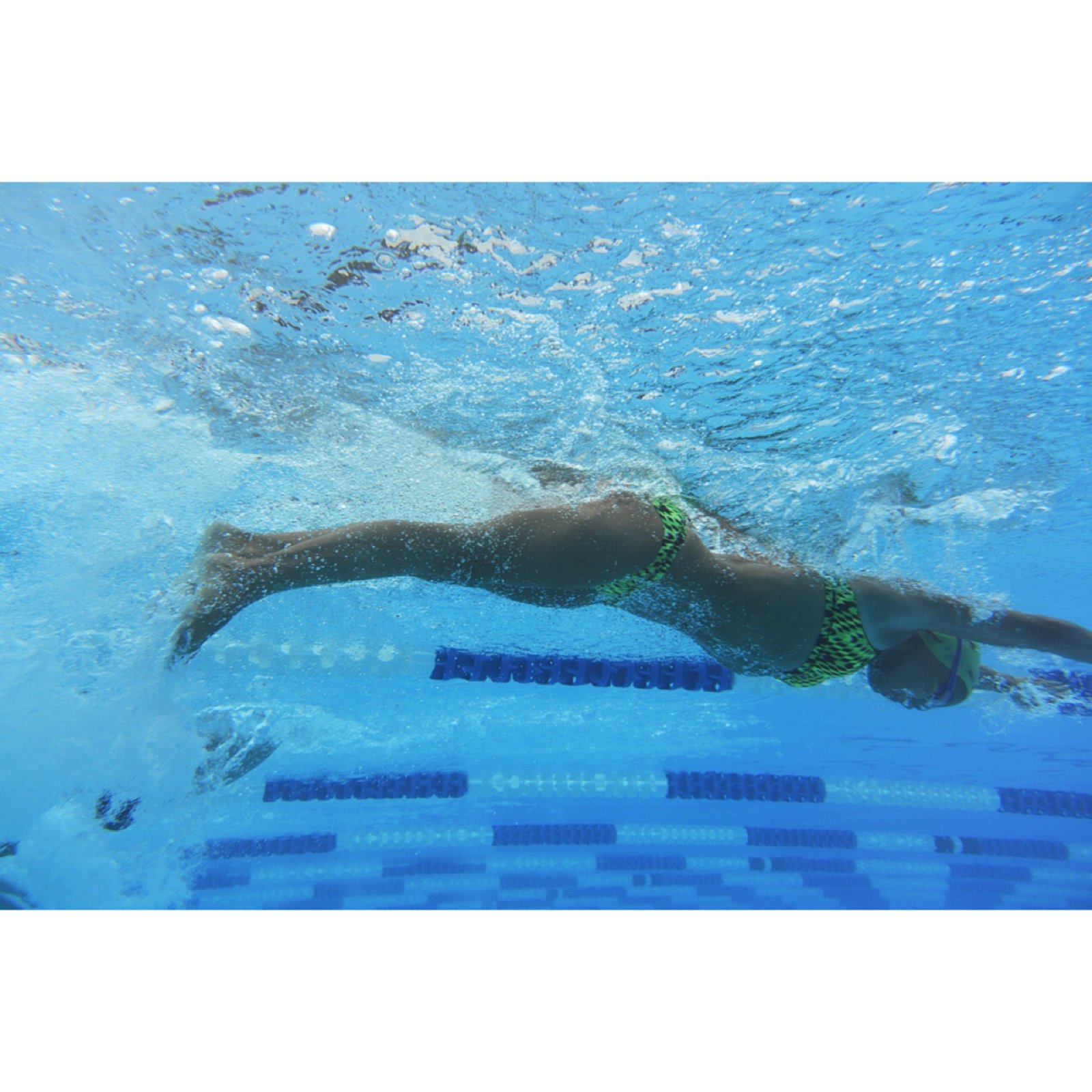 Isabelle McMullen swimming competitively