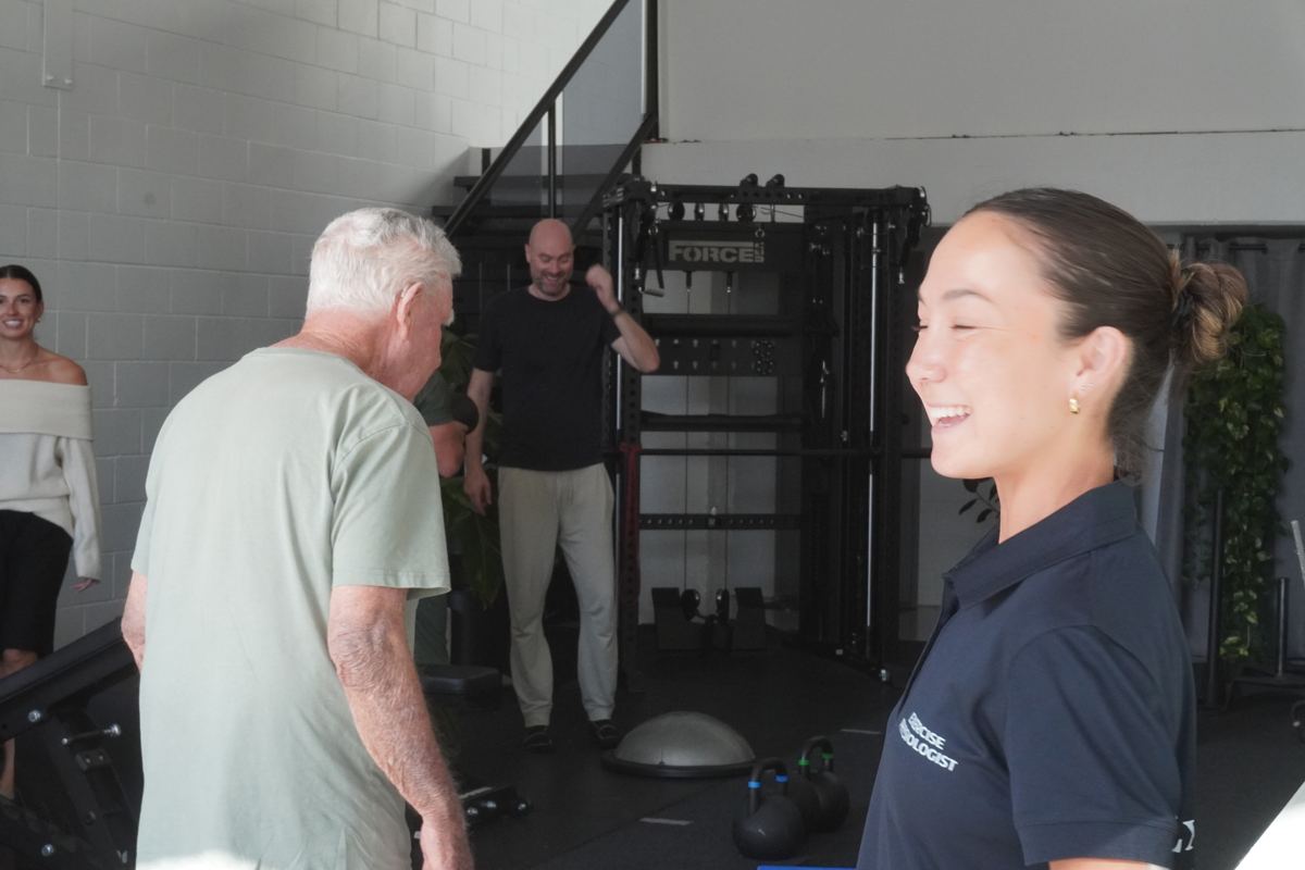 Isabelle McMullen, Exercise Physiologist, coaching a client at the Burleigh Heads clinic